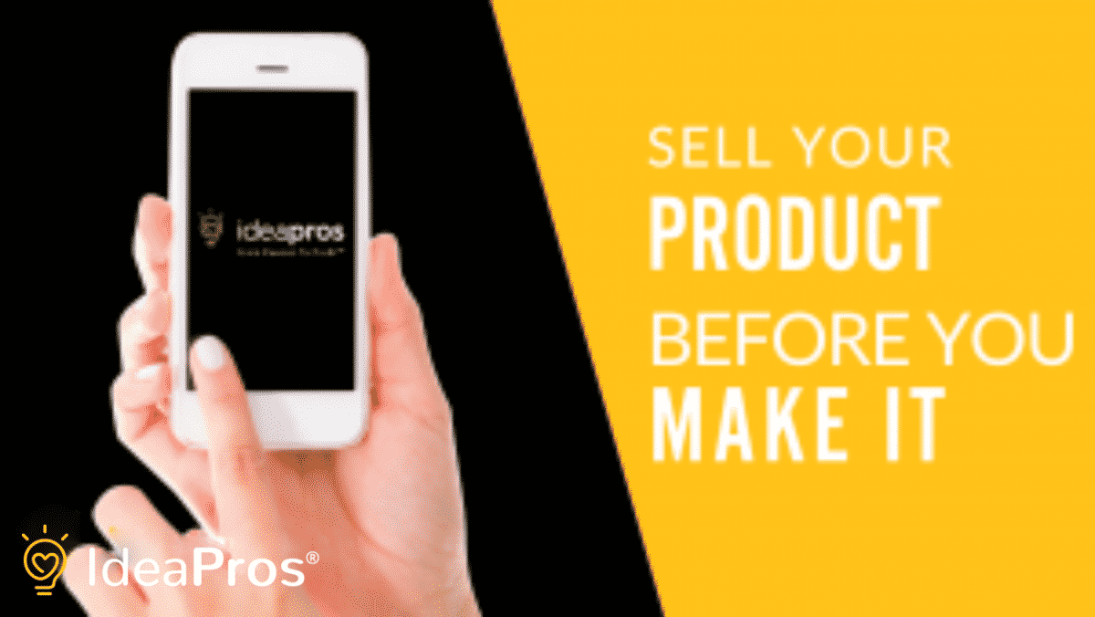 Person holding up a phone with the IdeaPros logo on the screen